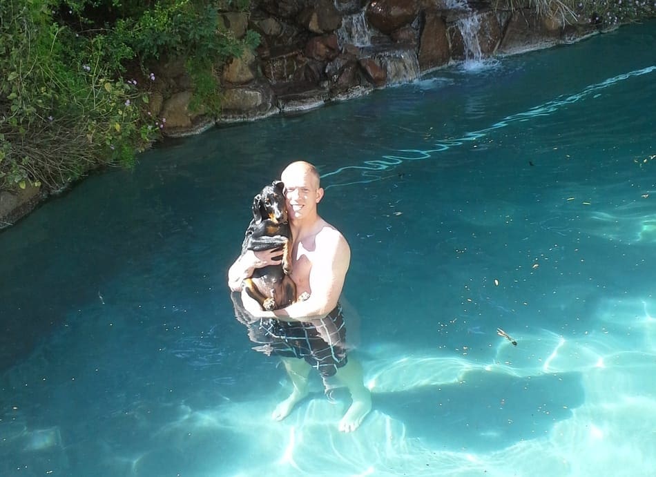 Me swimming with my Doberman Cooper.